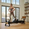 NordicTrack Ultra 1 Reformer pilates reformer | 24-palčni vrtljivi in nagibni zaslon na dotik, Tri vzmeti 10, 15 in 20 kg, Sedem kombinacij do 45 kg | Vadite po svojem načrtu - Thumbnail Image 8